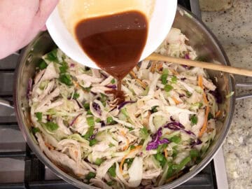 Adding the scallions and sauce.