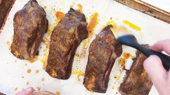 Basting the ribs.
