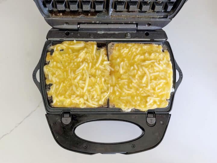 The batter was poured into the waffle iron cavities.