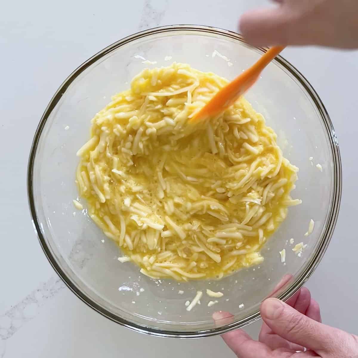 Combining the ingredients in a bowl.