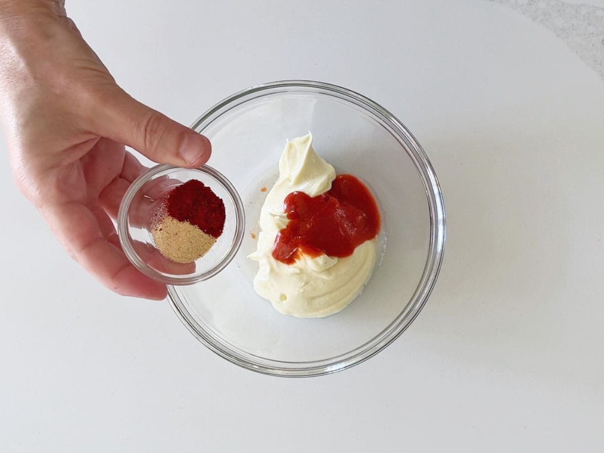 Combining the ingredients in a bowl.