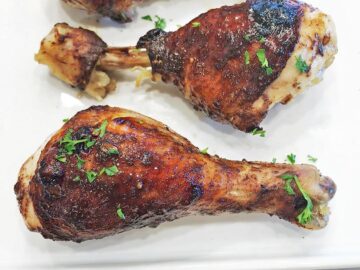 The chicken is served, garnished with parsley.