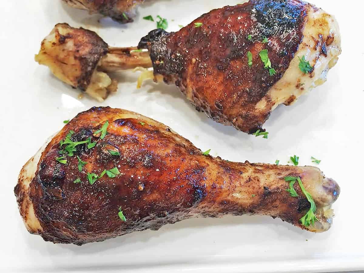 The chicken is served, garnished with parsley.