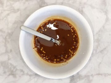 Mixing the sauce in a bowl.