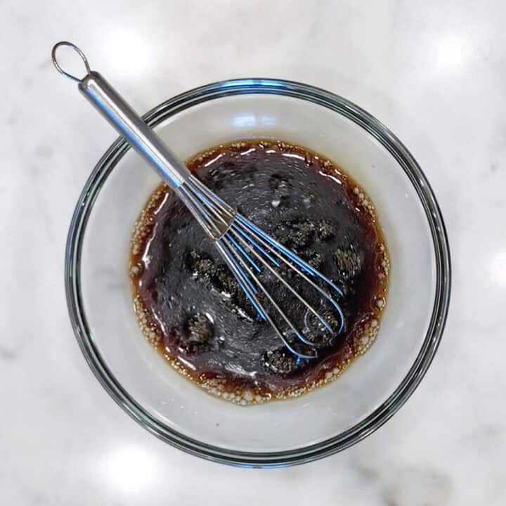 Mixing the sauce ingredients in a small bowl.