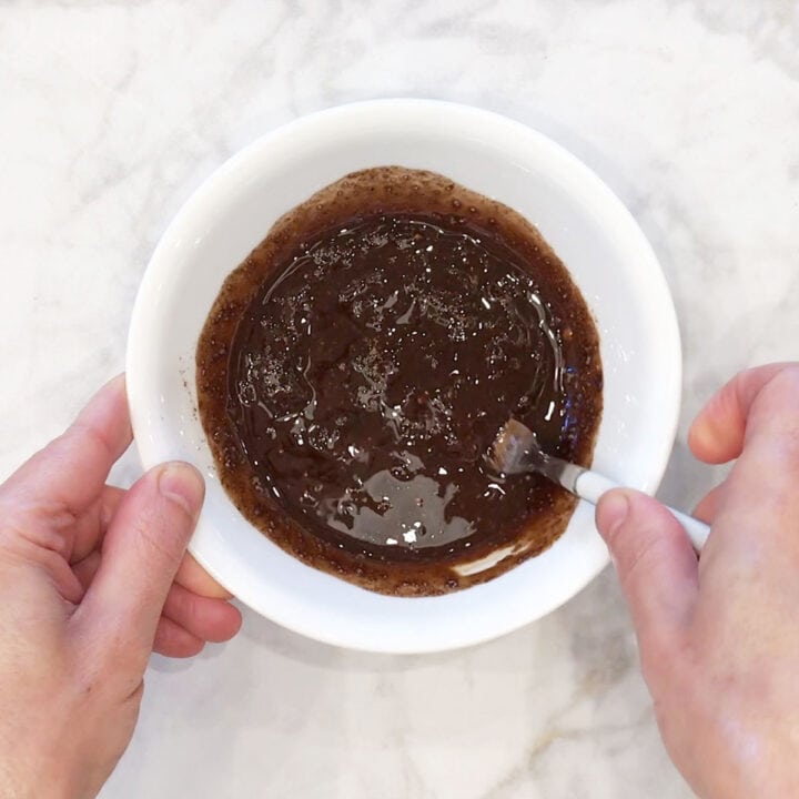 Mixing jerk seasoning in a bowl.