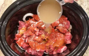 Adding the ingredients to the slow cooker.