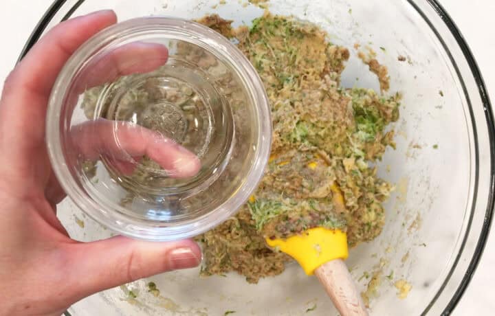 Adding water to the batter.