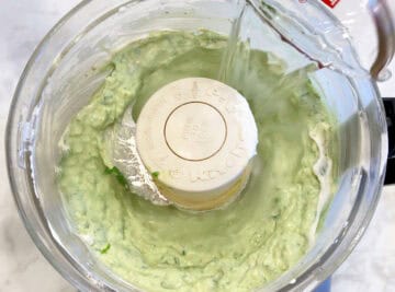 Adding water to the mixture.