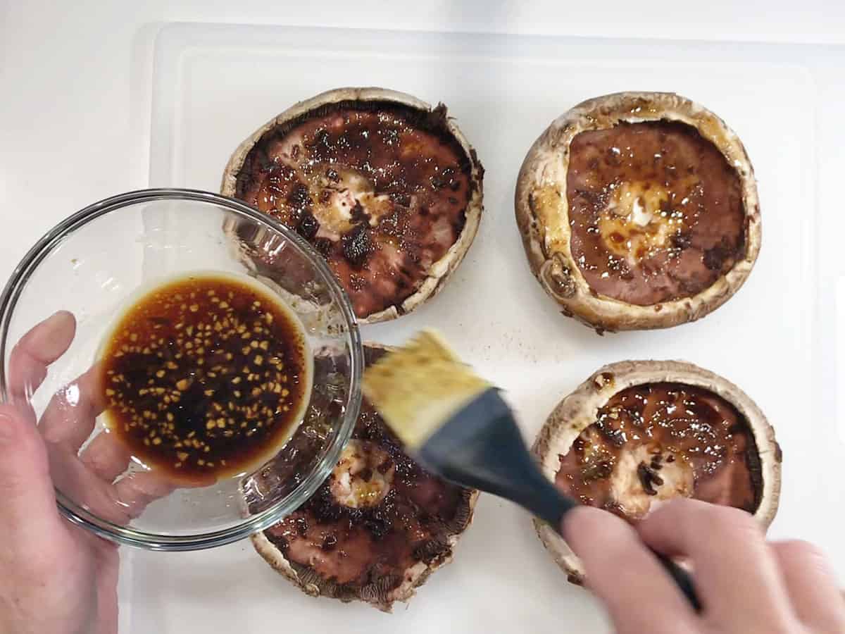 Brushing the gill side with the marinade.