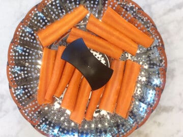 The carrots were placed in a steamer basket.