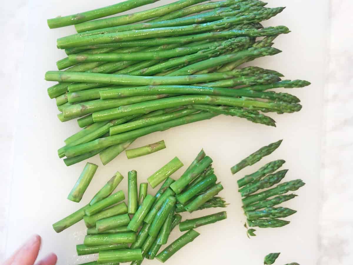 Chopping the asparagus.