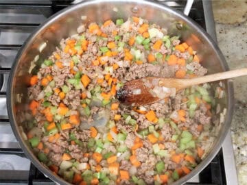 Cooked beef and vegetables in a pot.