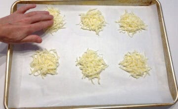 Flattening the cheese mounds.