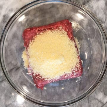 Meatball ingredients were added to a bowl.