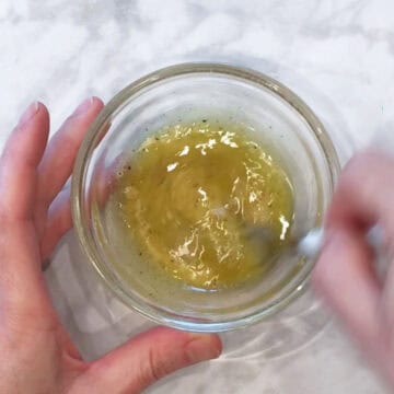 Mixing the dressing.