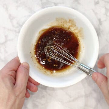 Mixing the marinade in a bowl.