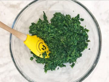 Drained spinach in a bowl.