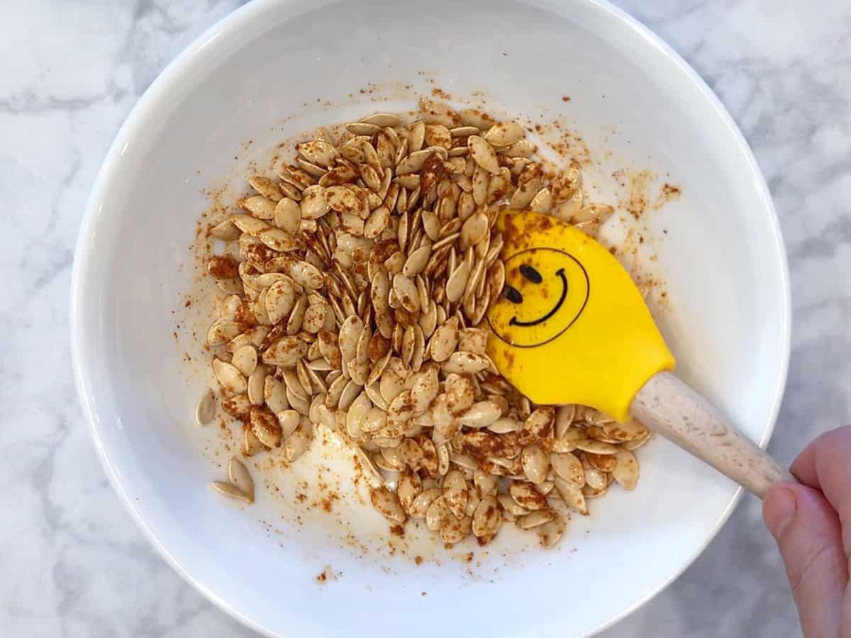 Seasoning the seeds.