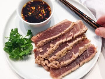 The tuna is served with the dipping sauce.