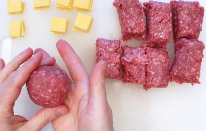 Shaping the meat portion into a meatball.
