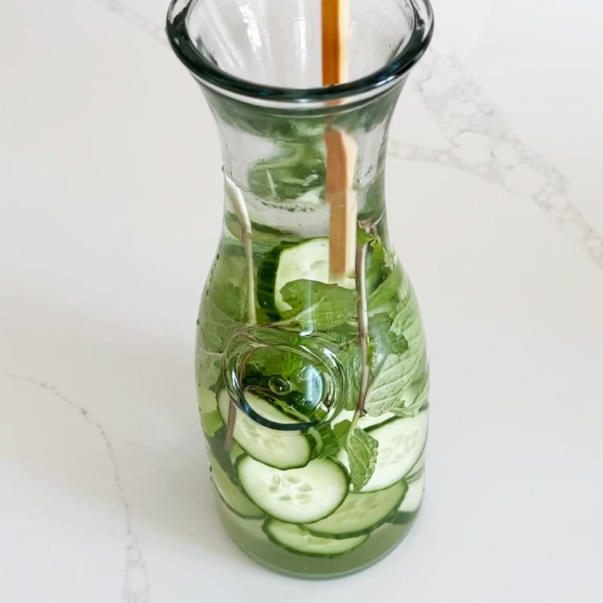 Stirring with a chopstick.