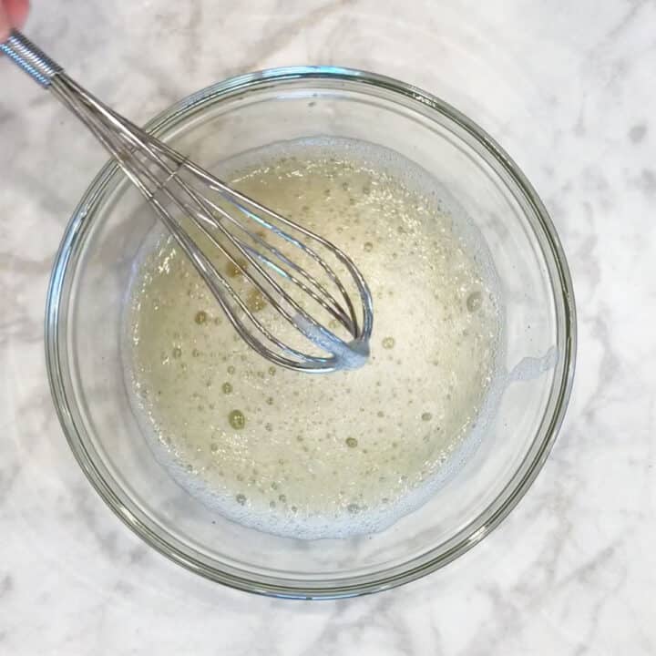 Whipping the egg whites.