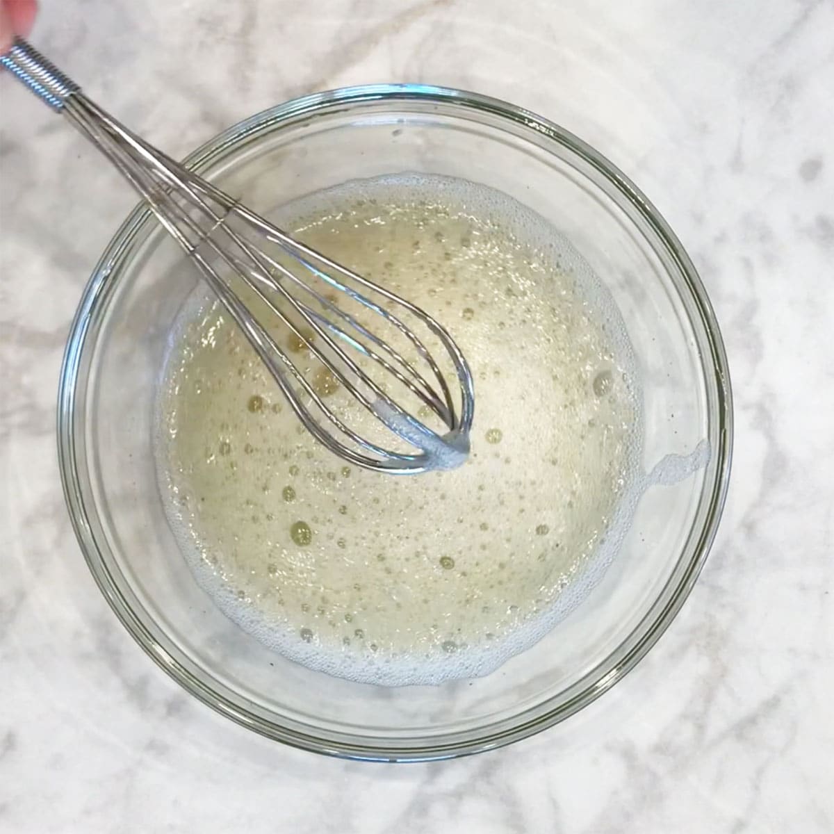 Whipping the egg whites.