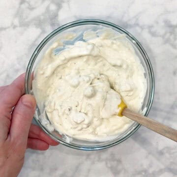 Mixing in the blue cheese.