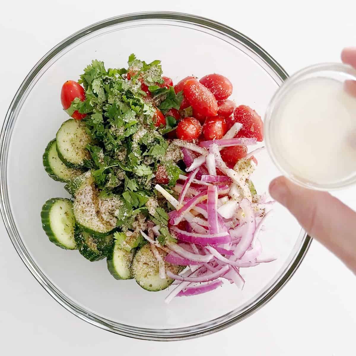 Adding lemon juice to the salad.