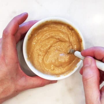 Mixing water into the batter.
