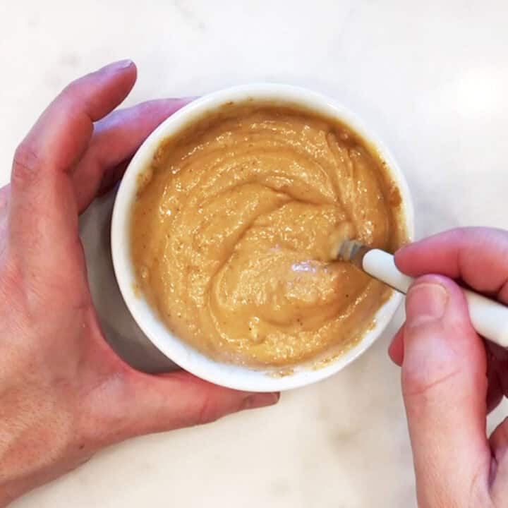 Mixing water into the batter.