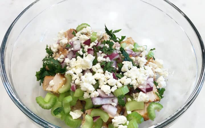 The salad ingredients were added to a bowl.