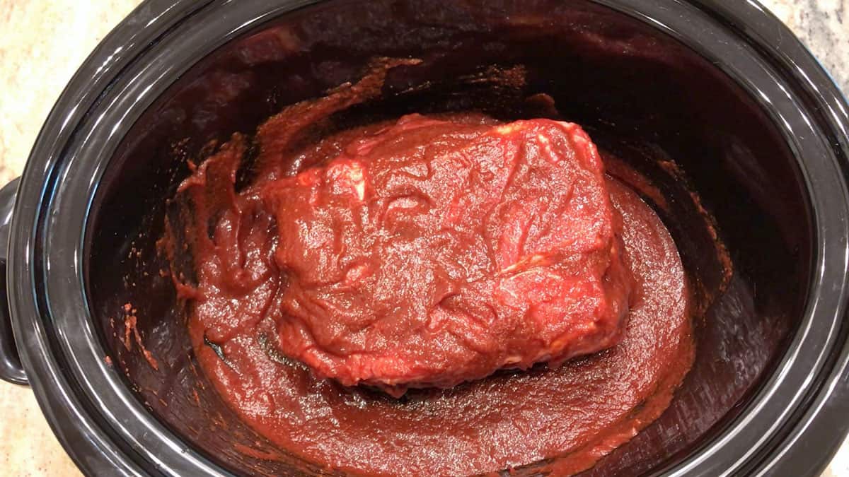 The meat was coated in BBQ sauce.