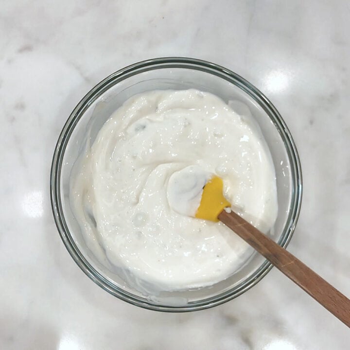 Mixing the blue cheese dressing.