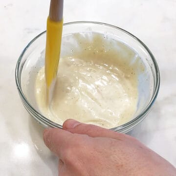 Mixing the dressing in a small bowl.