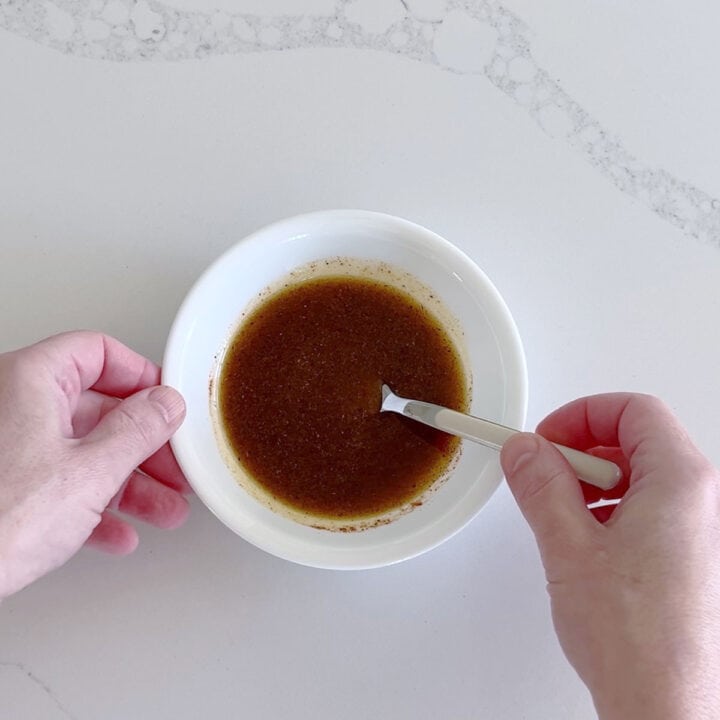 Mixing the marinade in a small bowl.