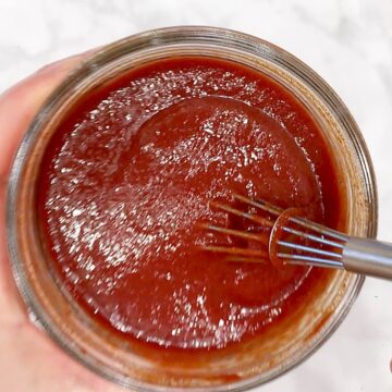 Mixing homemade BBQ sauce.