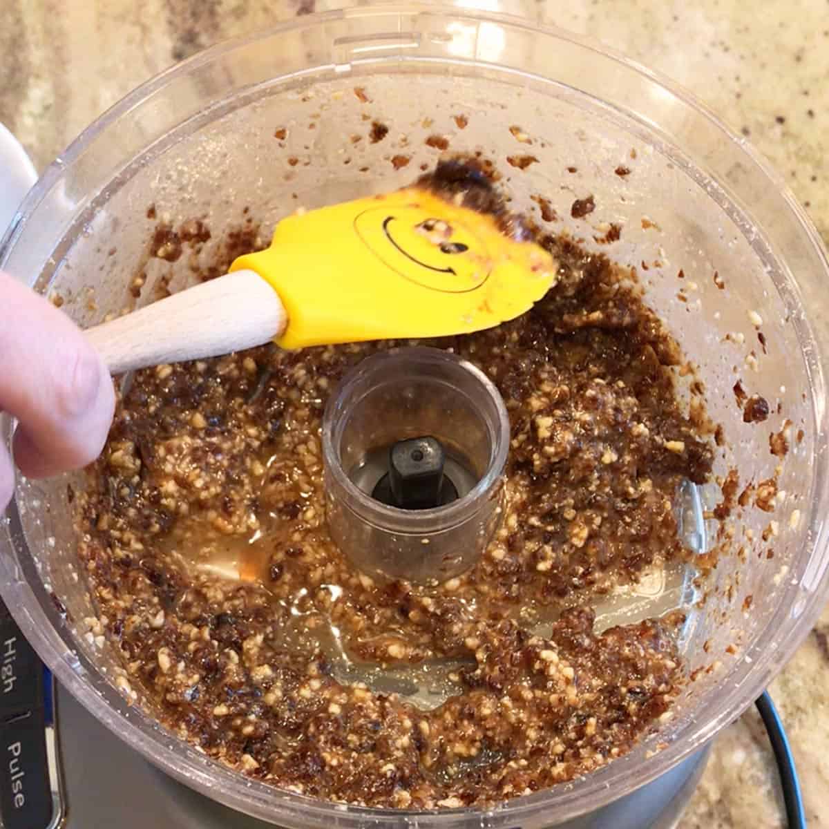 Mixing the charoset with a spatula.
