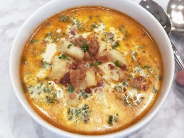 The chowder is served with a spoon.