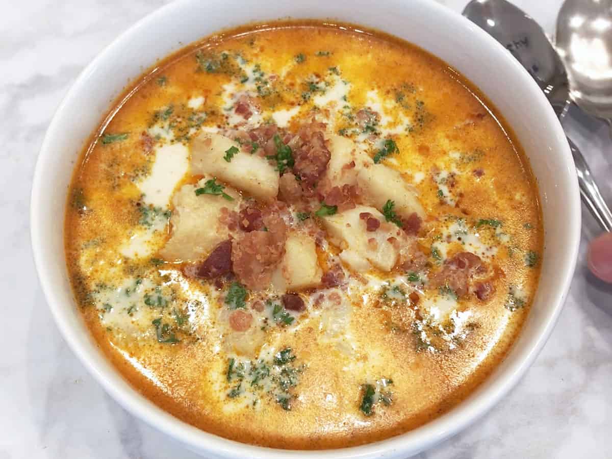 The chowder is served with a spoon.