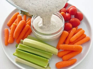 Transferring the dressing to a serving bowl.