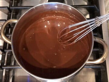 Whisking the pudding ingredients to combine.