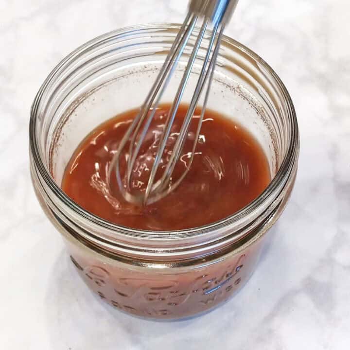 Whisking the sauce.