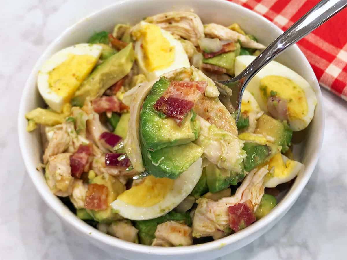 The salad is served with a fork.