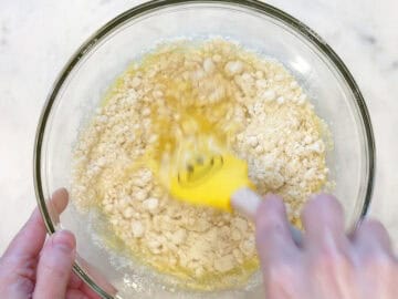 Adding almond flour to the batter.