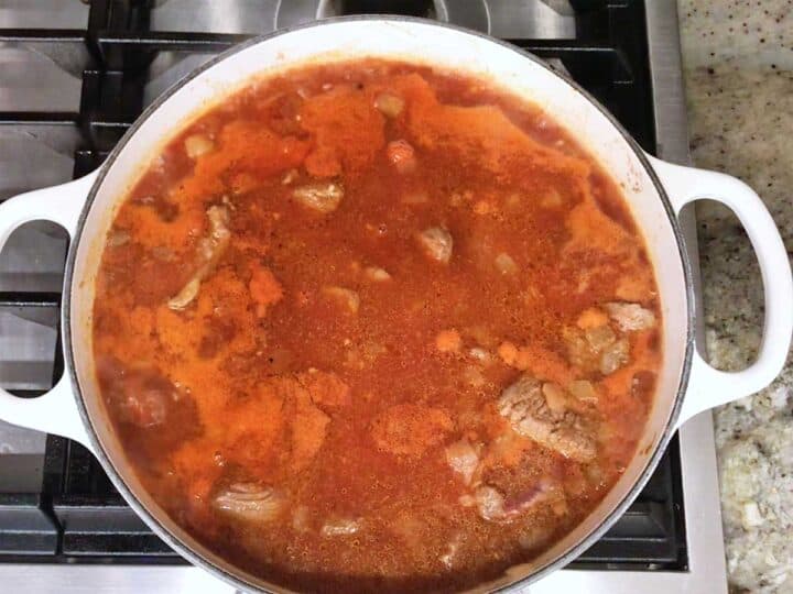 Bringing the stew to a boil.