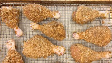 The coated chicken is on the pan and ready for the oven.