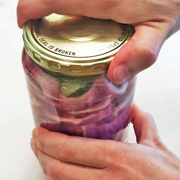 Closing the jar's lid.