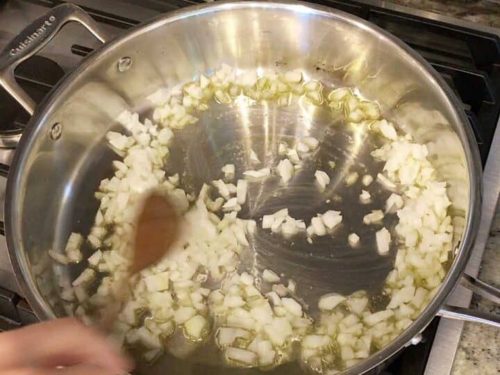 Sauteing the onions in a skillet.